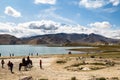 Aug 2017 Ã¢â¬â Xinjiang, China Ã¢â¬â tourists on the shores of Karakul Lake along Karakorum Highway Royalty Free Stock Photo